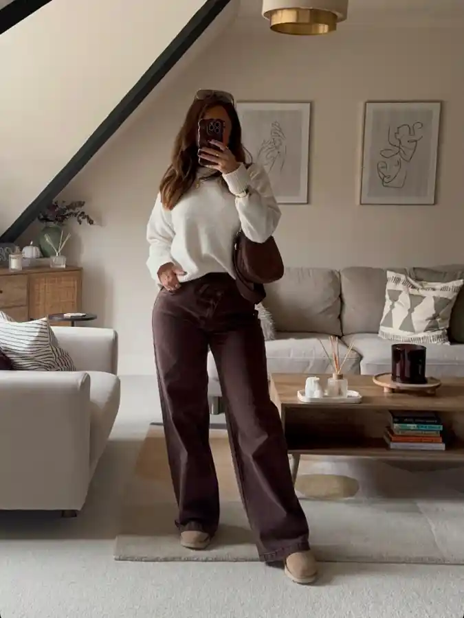 19 Chic outfits for work with jeans That Look Professional 10 Cozy Wide-Leg Jeans and Knit Sweater