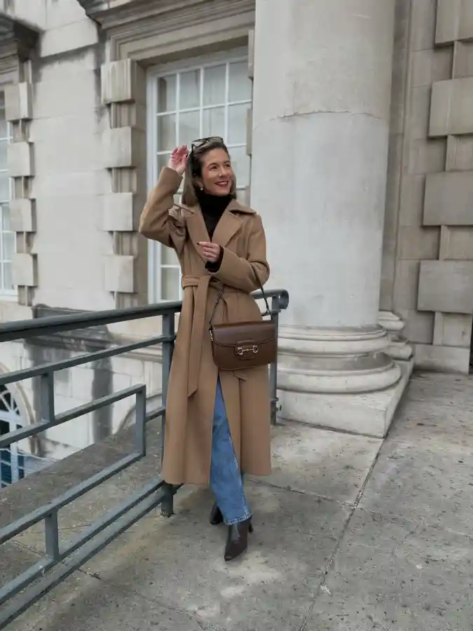 17 Chic Winter Business Casual Outfits for Women over 40 11 Elevated Camel Coat and Denim Pairing